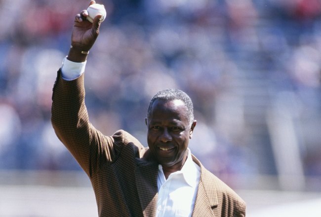 MILWAUKEE - APRIL 7:  Hank Aaron throws out the first pitch before the Milwaukee Brewers game against the Montreal Expos at County Stadium on April 7, 1998 in Milwaukee, Wisconsin. (Photo by Jonathan Kirn/Getty Images)