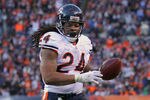 DENVER, CO - DECEMBER 11:  Running back Marion Barber #24 of the Chicago Bears rushes nine yards for a third quarter touchdown to give the Bears a 7-0 lead over the Denver Broncos at Sports Authority Field at Mile High on December 11, 2011 in Denver, Colorado.  (Photo by Doug Pensinger/Getty Images)