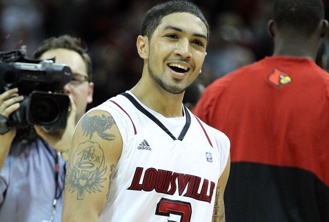 LOUISVILLE, KY - DECEMBER 02:  Peyton Siva #3 of the Louisville Cardinals celebrates after hitting the  winning shot in overtime to beat the Vanderbilt Commodores 62-60 in the game at KFC YUM! Center on December 2, 2011 in Louisville, Kentucky.  (Photo by Andy Lyons/Getty Images)