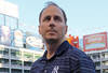 ARLINGTON, TX - OCTOBER 16:  General Manager of the New York Yankees Brian Cashman looks on during a game against the Texas Rangers in Game Two of the ALCS during the 2010 MLB Playoffs at Rangers Ballpark in Arlington on October 16, 2010 in Arlington, Texas.  (Photo by Stephen Dunn/Getty Images)