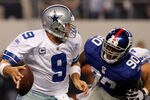 ARLINGTON, TX - DECEMBER 11:  Tony Romo #9 of the Dallas Cowboys is sacked in the New York Giants end zone by  Jason Pierre-Paul #90 of the New York Giants for a safety at Cowboys Stadium on December 11, 2011 in Arlington, Texas.  (Photo by Tom Pennington/Getty Images)