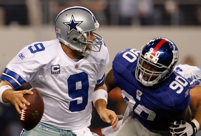 ARLINGTON, TX - DECEMBER 11:  Tony Romo #9 of the Dallas Cowboys is sacked in the New York Giants end zone by  Jason Pierre-Paul #90 of the New York Giants for a safety at Cowboys Stadium on December 11, 2011 in Arlington, Texas.  (Photo by Tom Pennington/Getty Images)