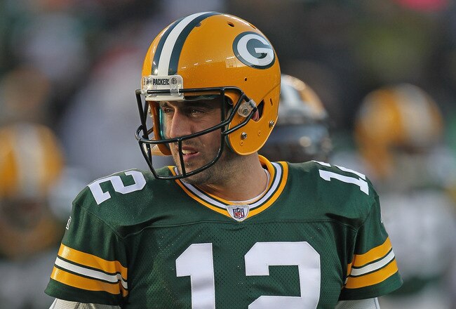 GREEN BAY, WI - DECEMBER 11:  Aaron Rodgers #12 of the Green Bay Packers participates in warm-ups before a game against the Oakland Raiders at Lambeau Field on December 11, 2011 in Green Bay, Wisconsin. The Packers defeated the Raiders 46-16.  (Photo by Jonathan Daniel/Getty Images)