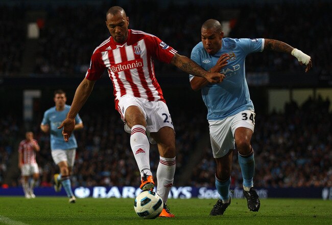 MANCHESTER, ENGLAND - MAY 17:  John Carew of Stoke City holds off Nigel De Jong of Manchester City during the Barclays Premier League match between Manchester City and Stoke City at City of Manchester Stadium on May 17, 2011 in Manchester, England.  (Photo by Clive Brunskill/Getty Images)