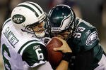 PHILADELPHIA, PA - DECEMBER 18:  Mark Sanchez #6 of the New York Jets is sacked by Jason Babin #93 of the Philadelphia Eagles during the first half at Lincoln Financial Field on December 18, 2011 in Philadelphia, Pennsylvania.  (Photo by Rob Carr/Getty Images)