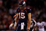 DENVER, CO - DECEMBER 18:  Quarterback Tim Tebow #15 of the Denver Broncos reacts as he walks to the huddle during the fourth quarter against the New England Patriots at Sports Authority Field at Mile High on December 18, 2011 in Denver, Colorado. The Broncos defeated the Bears 13-10 in overtime. (Photo by Justin Edmonds/Getty Images)