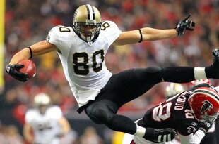 ATLANTA, GA - NOVEMBER 13:  Jimmy Graham #80 of the New Orleans Saints hurdles over Thomas DeCoud #28 of the Atlanta Falcons at Georgia Dome on November 13, 2011 in Atlanta, Georgia.  (Photo by Kevin C. Cox/Getty Images)