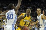 NEWARK, NJ - MARCH 25:  Jimmy Butler #33 of the Marquette Golden Eagles against Harrison Barnes #40 of the North Carolina Tar Heels during the east regional semifinal of the 2011 NCAA Men's Basketball Tournament at the Prudential Center on March 25, 2011 in Newark, New Jersey.  (Photo by Nick Laham/Getty Images)