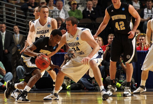 DENVER, CO - MARCH 17:  Jamar Diggs #5 of the Wofford Terriers handles the ball against Noah Hartsock #34 of the Brigham Young Cougars during the second round of the 2011 NCAA men's basketball tournament at Pepsi Center on March 17, 2011 in Denver, Colorado.  (Photo by Doug Pensinger/Getty Images)