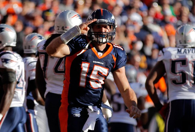 DENVER, CO - DECEMBER 18:  Quarterback Tim Tebow #15 of the Denver Broncos celebrates after scoring a touchdown against the New England Patriots in the first quarter at Sports Authority Field at Mile High on December 18, 2011 in Denver, Colorado.  (Photo by Justin Edmonds/Getty Images)