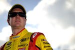 HOMESTEAD, FL - NOVEMBER 19:  Kurt Busch, driver of the #22 Shell/Pennzoil Dodge, stands on the grid during qualifying for the NASCAR Sprint Cup Series Ford 400 at Homestead-Miami Speedway on November 19, 2011 in Homestead, Florida.  (Photo by Jared C. Tilton/Getty Images)