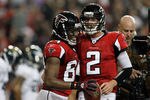 ATLANTA, GA - DECEMBER 15:  (L-R) Roddy White #84 and Matt Ryan #2 of the Atlanta Falcons celebrate after White scored a 6-yard touchdown reception in the second quarter against the Jacksonville Jaguars at the Georgia Dome on December 15, 2011 in Atlanta, Georgia.  (Photo by Kevin C. Cox/Getty Images)