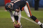 CHICAGO, IL - DECEMBER 04: Caleb Hanie #12 of the Chicago Bears picks up the ball after it was stripped by the Kansas City Chief defense at Soldier Field on December 4, 2011 in Chicago, Illinois. The Chiefs defeated the Bears 10-3. (Photo by Jonathan Daniel/Getty Images)