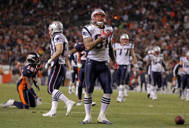 DENVER, CO - DECEMBER 18:  Tight end Aaron Hernandez #81 of the New England Patriots celebrates after a play against the Denver Broncos at Sports Authority Field at Mile High on December 18, 2011 in Denver, Colorado.  (Photo by Doug Pensinger/Getty Images)