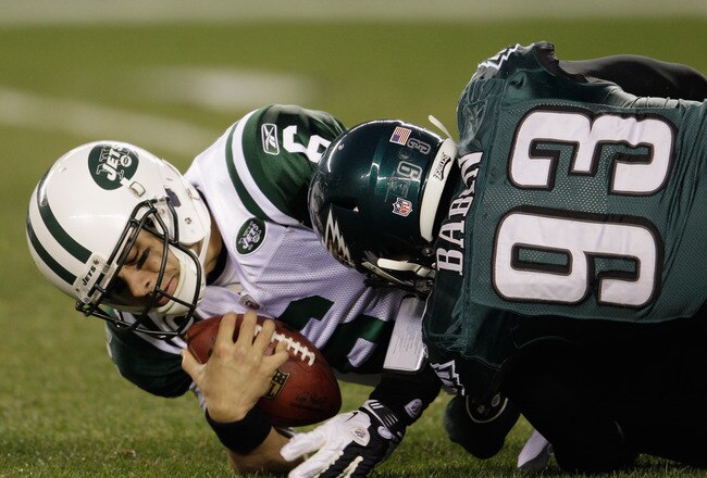 PHILADELPHIA, PA - DECEMBER 18:  Mark Sanchez #6 of the New York Jets is sacked by Jason Babin #93 of the Philadelphia Eagles during the first half at Lincoln Financial Field on December 18, 2011 in Philadelphia, Pennsylvania.  (Photo by Rob Carr/Getty Images)