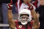 GLENDALE, AZ - DECEMBER 18:  Wide receiver Larry Fitzgerald #11 of the Arizona Cardinals celebrates after a 32 yard reception against the Cleveland Browns during overtime of the NFL game at the University of Phoenix Stadium on December 18, 2011 in Glendale, Arizona. The Cardinals defeated the Browns 20-17 in overtime.  (Photo by Christian Petersen/Getty Images)