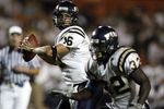 MIAMI - OCTOBER 14:  Josh Padrick #16 of the Florida International University Panthers attempts to pass as Julian Reams #32 blocks against the University of Miami Hurricanes at the Orange Bowl on October 14, 2006 in Miami, Florida.  (Photo by Marc Serota/Getty Images)
