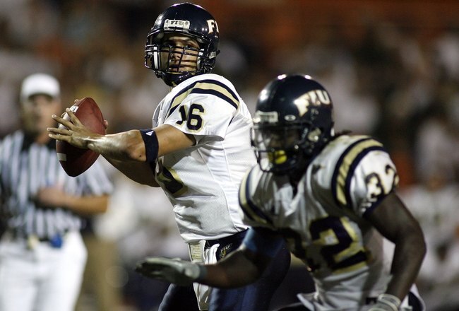 MIAMI - OCTOBER 14:  Josh Padrick #16 of the Florida International University Panthers attempts to pass as Julian Reams #32 blocks against the University of Miami Hurricanes at the Orange Bowl on October 14, 2006 in Miami, Florida.  (Photo by Marc Serota/Getty Images)