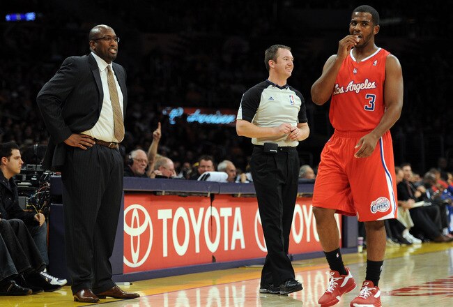 LOS ANGELES, CA - DECEMBER 19:  Head Coach Mike Brown of the Los Angeles Lakers talks to Chris Paul #3 of the Los Angeles Clippers during a 114-95 Clipper win at Staples Center on December 19, 2011 in Los Angeles, California.  (Photo by Harry How/Getty Images)