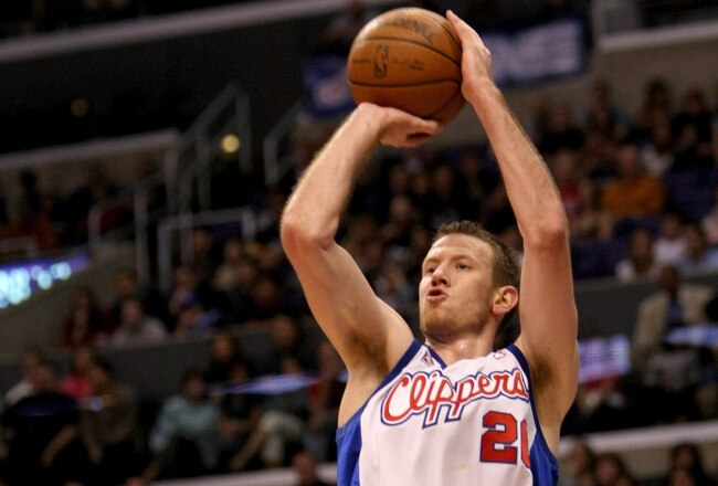 LOS ANGELES, CA - JANUARY 17: Steve Novak #21 of the Los Angeles Clippers shoots over Luke Ridnour #13 of the Milwaukee Bucks on January 17, 2009 at Staples Center in Los Angeles, California.  The Clippers won 101-92.  NOTE TO USER: User expressly acknowledges and agrees that, by downloading and/or using this Photograph, user is consenting to the terms and conditions of the Getty Images License Agreement.  (Photo by Stephen Dunn/Getty Images)