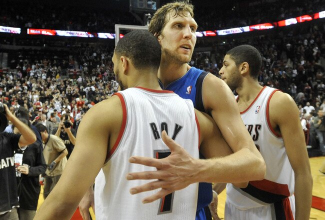 PORTLAND, OR - APRIL 28: Dirk Nowitzki #41 of the Dallas Mavericks hugs Brandon Roy #7 of the Portland Trail Blazers after Game Six of the Western Conference Quartefinals against the Portland Trail Blazers in the 2011 NBA Playsoffs on April 28, 2011 at the Rose garden in Portland, Oregon. The Mavericks won the game 103-96 to win the series and advance. NOTE TO USER: User expressly acknowledges and agrees that, by downloading and or using this photograph, User is consenting to the terms and conditions of the Getty Images License Agreement. (Photo by Steve Dykes/Getty Images)