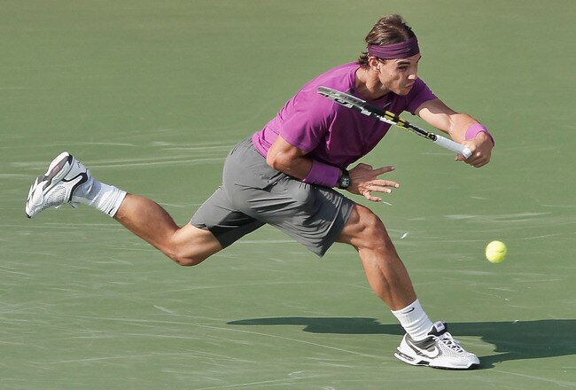 TOKYO, JAPAN - OCTOBER 09:  Rafael Nadal of Spain plays a forehand in his singles final during the match against Andy Murray of Great Britain during day seven of the Rakuten Open at Ariake Colosseum on October 9, 2011 in Tokyo, Japan.  (Photo by Lintao Zhang/Getty Images)