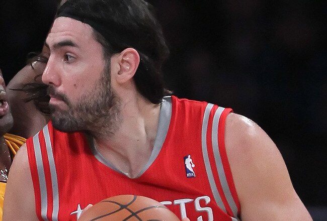 LOS ANGELES, CA - FEBRUARY 01:  Luis Scola #4 of the Houston Rockets is defended by Lamar Odom #7 of the Los Angeles Lakers in the first half at Staples Center on February 1, 2011 in Los Angeles, California. The Lakers defeated the Rockets 114-106. NOTE TO USER: User expressly acknowledges and agrees that, by downloading and or using this photograph, User is consenting to the terms and conditions of the Getty Images License Agreement.  (Photo by Jeff Gross/Getty Images)