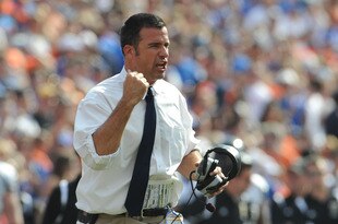 GAINESVILLE, FL - NOVEMBER 21: Coacg Mario Cristobal of the Florida International University Golden Panthers directs play against the Florida Gators, November 21, 2009 at Ben Hill Griffin Stadium in Gainesville, Florida.  (Photo by Al Messerschmidt/Getty Images)