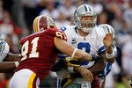 LANDOVER, MD - NOVEMBER 20:  Ryan Kerrigan #91 of the Washington Redskins hits  Tony Romo #9 of the Dallas Cowboys after Romo threw a pass during the second half at FedExField on November 20, 2011 in Landover, Maryland.  (Photo by Rob Carr/Getty Images)