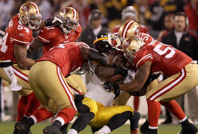 SAN FRANCISCO, CA - DECEMBER 19:  Rashard Mendenhall #34 of the Pittsburgh Steelers loses his helmet while being tackled by the San Francisco 49ers  at Candlestick Park on December 19, 2011 in San Francisco, California.  (Photo by Ezra Shaw/Getty Images)