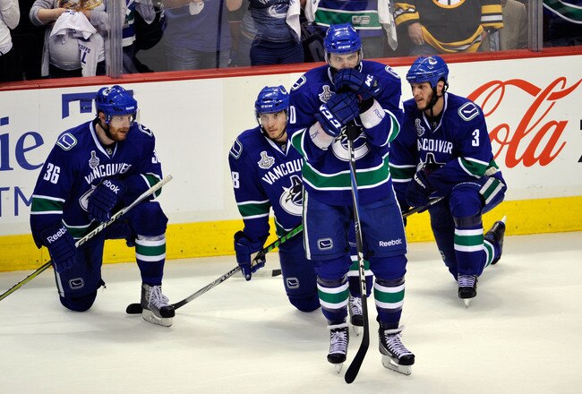VANCOUVER, BC - JUNE 15:  The Vancouver Canucks react after being defeated by the Boston Bruins in Game Seven of the 2011 NHL Stanley Cup Final at Rogers Arena on June 15, 2011 in Vancouver, British Columbia, Canada. The Boston Bruins defeated the Vancouver Canucks 4 to 0.  (Photo by Rich Lam/Getty Images)