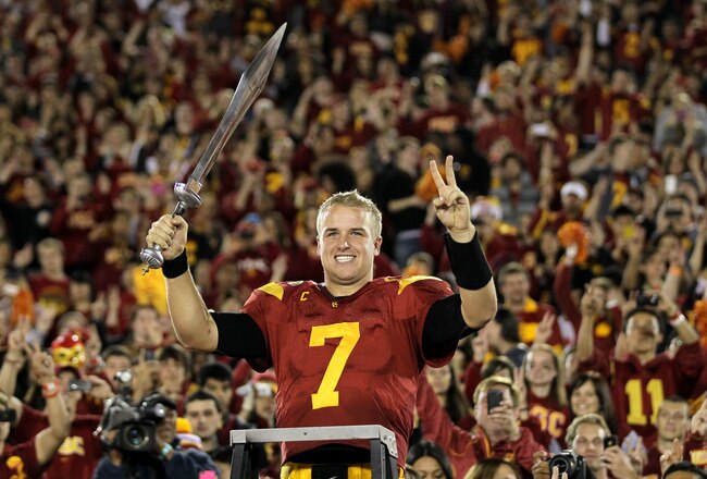 LOS ANGELES, CA - NOVEMBER 26:  Quarterback Matt Barkley #7 of the USC Trojans conducts the band after the game with the UCLA Bruins at the Los Angeles Memorial Coliseum on November 26, 2011 in Los Angeles, California. USC won 50-0.  (Photo by Stephen Dunn/Getty Images)