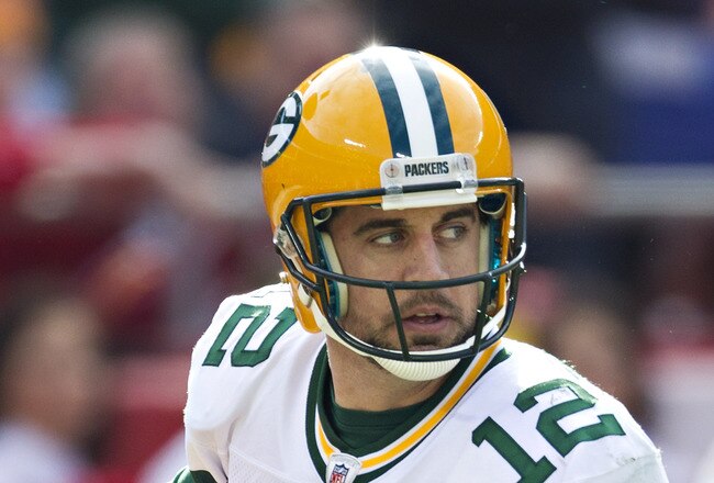 KANSAS CITY, MO - DECEMBER 18:   Aaron Rodgers #12 of the Green Bay Packers rolls out looking for a receiver against the Kansas City Chiefs at Arrowhead Stadium on December 18, 2011 in Kansas CIty, Missouri.  The Chiefs defeated the Packers 19-14.   (Photo by Wesley Hitt/Getty Images)