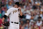 PITTSBURGH - AUGUST 17:  Paul Maholm #28 of the Pittsburgh Pirates wipes the sweat off of his face in between pitches against the St Louis Cardinals during the game on August 17, 2011 at PNC Park in Pittsburgh, Pennsylvania.  (Photo by Jared Wickerham/Getty Images)