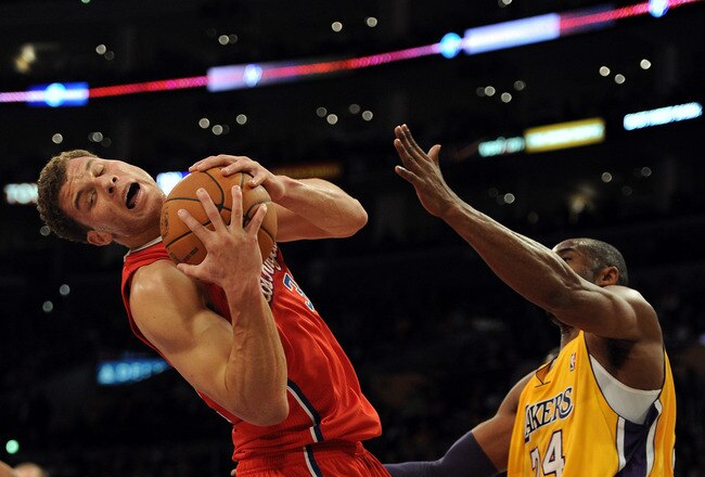 LOS ANGELES, CA - DECEMBER 19:  Blake Griffin #32 of the Los Angeles Clippers is fouled off a rebound by Kobe Bryant #24 of the Los Angeles Lakers at Staples Center on December 19, 2011 in Los Angeles, California.  (Photo by Harry How/Getty Images)