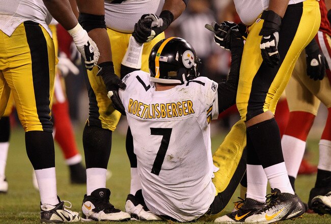 SAN FRANCISCO, CA - DECEMBER 19:  Ben Roethlisberger #7 of the Pittsburgh Steelers is helped off the ground after he was sacked by the San Francisco 49ers at Candlestick Park on December 19, 2011 in San Francisco, California.  (Photo by Ezra Shaw/Getty Images)