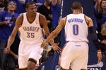 OKLAHOMA CITY, OK - MAY 23:  Kevin Durant #35 and Russell Westbrook #0 of the Oklahoma City Thunder react in the first half while taking on the Dallas Mavericks in Game Four of the Western Conference Finals during the 2011 NBA Playoffs at Oklahoma City Arena on May 23, 2011 in Oklahoma City, Oklahoma. NOTE TO USER: User expressly acknowledges and agrees that, by downloading and or using this photograph, User is consenting to the terms and conditions of the Getty Images License Agreement.  (Photo by Christian Petersen/Getty Images)