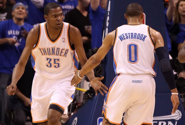 OKLAHOMA CITY, OK - MAY 23:  Kevin Durant #35 and Russell Westbrook #0 of the Oklahoma City Thunder react in the first half while taking on the Dallas Mavericks in Game Four of the Western Conference Finals during the 2011 NBA Playoffs at Oklahoma City Arena on May 23, 2011 in Oklahoma City, Oklahoma. NOTE TO USER: User expressly acknowledges and agrees that, by downloading and or using this photograph, User is consenting to the terms and conditions of the Getty Images License Agreement.  (Photo by Christian Petersen/Getty Images)