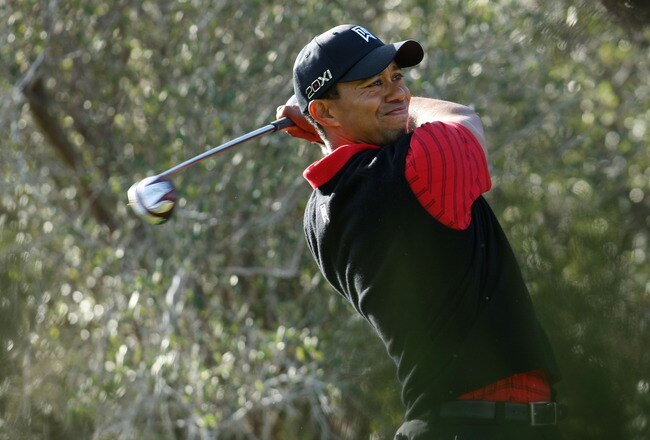 THOUSAND OAKS, CA - DECEMBER 04:  Tiger Woods hits his tee shot on the 13th hole during the final round of the Chevron World Challenge at Sherwood Country Club on December 4, 2011 in Thousand Oaks, California.  (Photo by Robert Meggers/Getty Images)