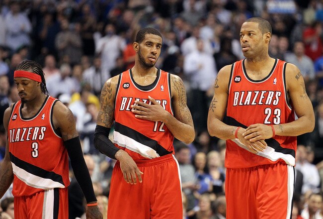 DALLAS, TX - APRIL 19:  (L-R) Gerald Wallace #3, LaMarcus Aldridge #12 and Marcus Camby #23 of the Portland Trail Blazers during a loss against the Dallas Mavericks in Game Two of the Western Conference Quarterfinals during the 2011 NBA Playoffs on April 19, 2011 at American Airlines Center in Dallas, Texas.  NOTE TO USER: User expressly acknowledges and agrees that, by downloading and or using this photograph, User is consenting to the terms and conditions of the Getty Images License Agreement.  (Photo by Ronald Martinez/Getty Images)