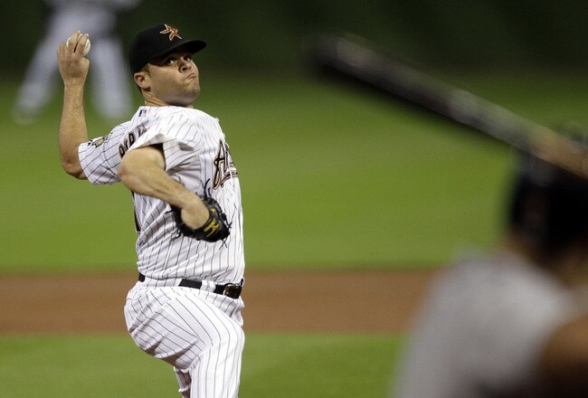 HOUSTON - SEPTEMBER 26:  Pitcher Wandy Rodriguez #51 of the Houston Astros throws against the St. Louis Cardinals at Minute Maid Park on September 26, 2011 in Houston, Texas.  (Photo by Bob Levey/Getty Images)