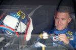 JOLIET, IL - SEPTEMBER 16:  A.J. Allmendinger, driver of the #43 Best Buy Ford, sits in his car in the garage during practice for the NASCAR Sprint Cup Series GEICO 400 at Chicagoland Speedway on September 16, 2011 in Joliet, Illinois.  (Photo by Todd Warshaw/Getty Images for NASCAR)