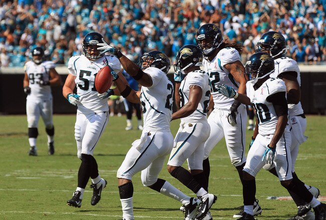 JACKSONVILLE, FL - SEPTEMBER 11:  Dwight Lowery #25 of the Jacksonville Jaguars celebrates after an interception to seal the game with a 16-14 victory over the Tennessee Titans during their season opener at EverBank Field on September 11, 2011 in Jacksonville, Florida.  (Photo by Streeter Lecka/Getty Images)