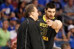 TAMPA, FL - MARCH 19:  (L-R) Head coach Bob Huggins of the West Virginia talks with Deniz Kilicli #13 against the Kentucky Wildcats during the third round of the 2011 NCAA men's basketball tournament at St. Pete Times Forum on March 19, 2011 in Tampa, Florida. Kentucky won 71-63. (Photo by J. Meric/Getty Images)
