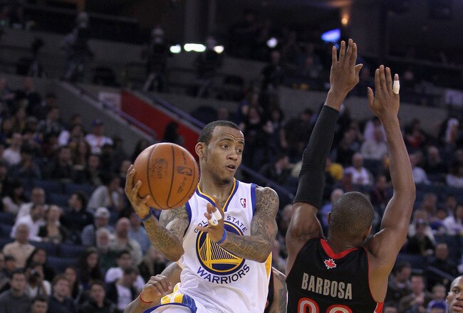 OAKLAND, CA - MARCH 25:  Monta Ellis #8 of the Golden State Warriors in action against the Toronto Raptors at Oracle Arena on March 25, 2011 in Oakland, California. NOTE TO USER: User expressly acknowledges and agrees that, by downloading and or using this photograph, User is consenting to the terms and conditions of the Getty Images License Agreement.  (Photo by Ezra Shaw/Getty Images)