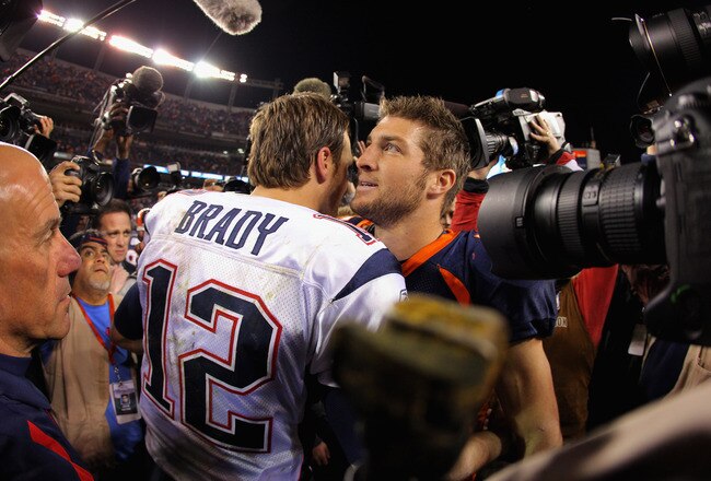 DENVER, CO - DECEMBER 18:  Quarterbacks Tom Brady #12 of the New England Patriots and Tim Tebow #15 of the Denver Broncos meet at midfield after the game at Sports Authority Field at Mile High on December 18, 2011 in Denver, Colorado. The Patriots defeated the Broncos 41-23.  (Photo by Doug Pensinger/Getty Images)