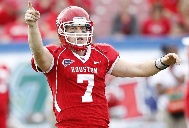 HOUSTON - DECEMBER 03:  Quarterback Case Keenum #7 of the Houston Cougars salutes the crowd for the last time after scoring in the fourth quarter against the Southern Miss Golden Eagles during the Conference USA championship game at Robertson Stadium on December 3, 2011 in Houston, Texas. Southern Miss Golden Eagles won 49-28.  (Photo by Bob Levey/Getty Images)