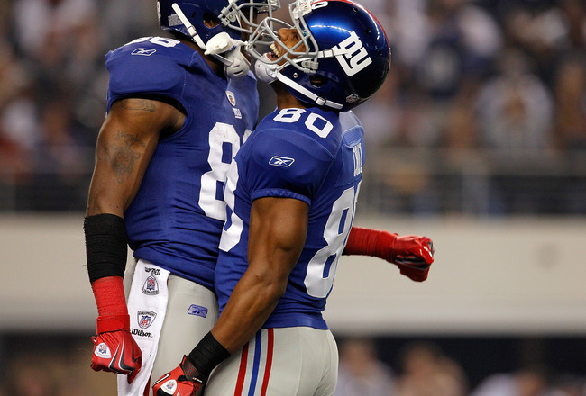 ARLINGTON, TX - DECEMBER 11:   Hakeem Nicks #88 of the New York Giants celebrates with  Victor Cruz #80 of the New York Giants while taking on the Dallas Cowboys at Cowboys Stadium on December 11, 2011 in Arlington, Texas.  (Photo by Tom Pennington/Getty Images)