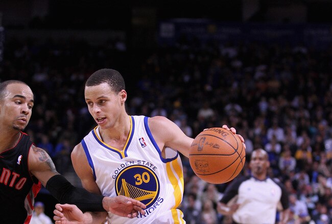 OAKLAND, CA - MARCH 25:  Stephen Curry #30 of the Golden State Warriors in action against the Toronto Raptors at Oracle Arena on March 25, 2011 in Oakland, California. NOTE TO USER: User expressly acknowledges and agrees that, by downloading and or using this photograph, User is consenting to the terms and conditions of the Getty Images License Agreement.  (Photo by Ezra Shaw/Getty Images)