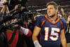 DENVER, CO - DECEMBER 18:  Quarterback Tim Tebow #15 of the Denver Broncos is the focus of the cameras as he leave the field after the game against the New England Patriots at Sports Authority Field at Mile High on December 18, 2011 in Denver, Colorado. The Patriots defeated the Broncos 41-23.  (Photo by Doug Pensinger/Getty Images)